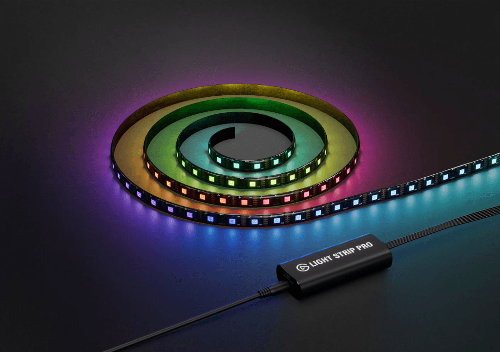 RGB LED strip light coiled showing vibrant colors with controller