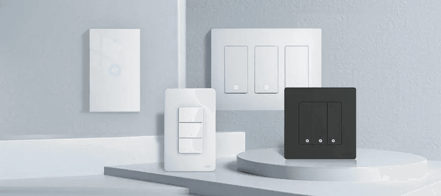 Collection of modern smart wall switches and relays in white and black